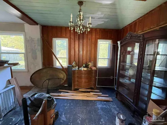 a room with furniture and chandelier