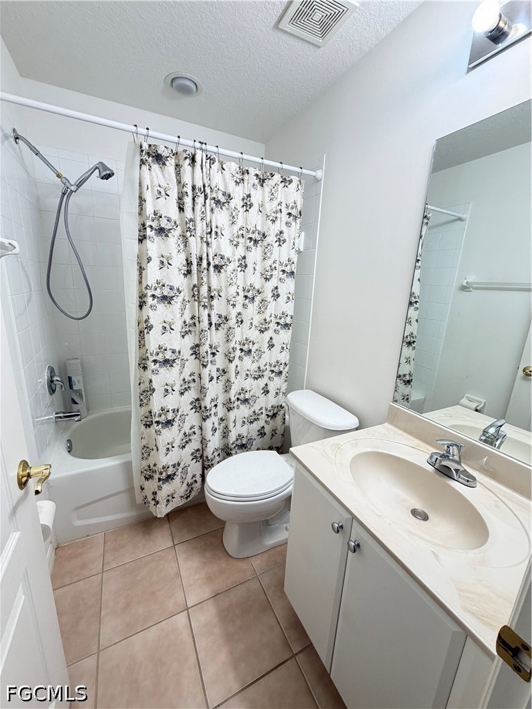 8541 Athena Court Lehigh Acres, FL 33971 - Photo 10 of 17 a bathroom with a sink toilet and shower