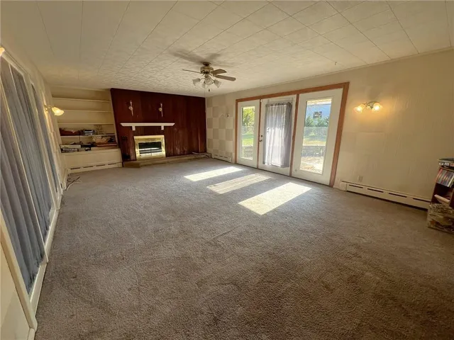 a view of a livingroom with furniture and a window