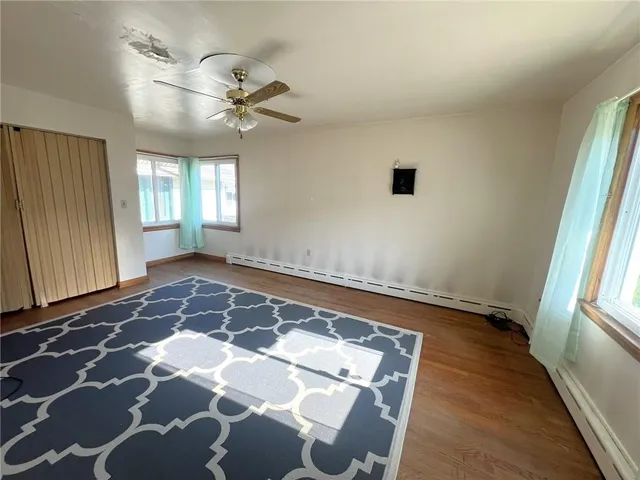a view of a room with window and furniture