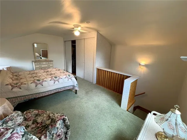 a bedroom with bed and a window