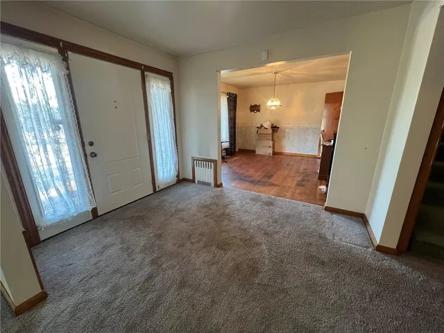 a view of a room with large windows