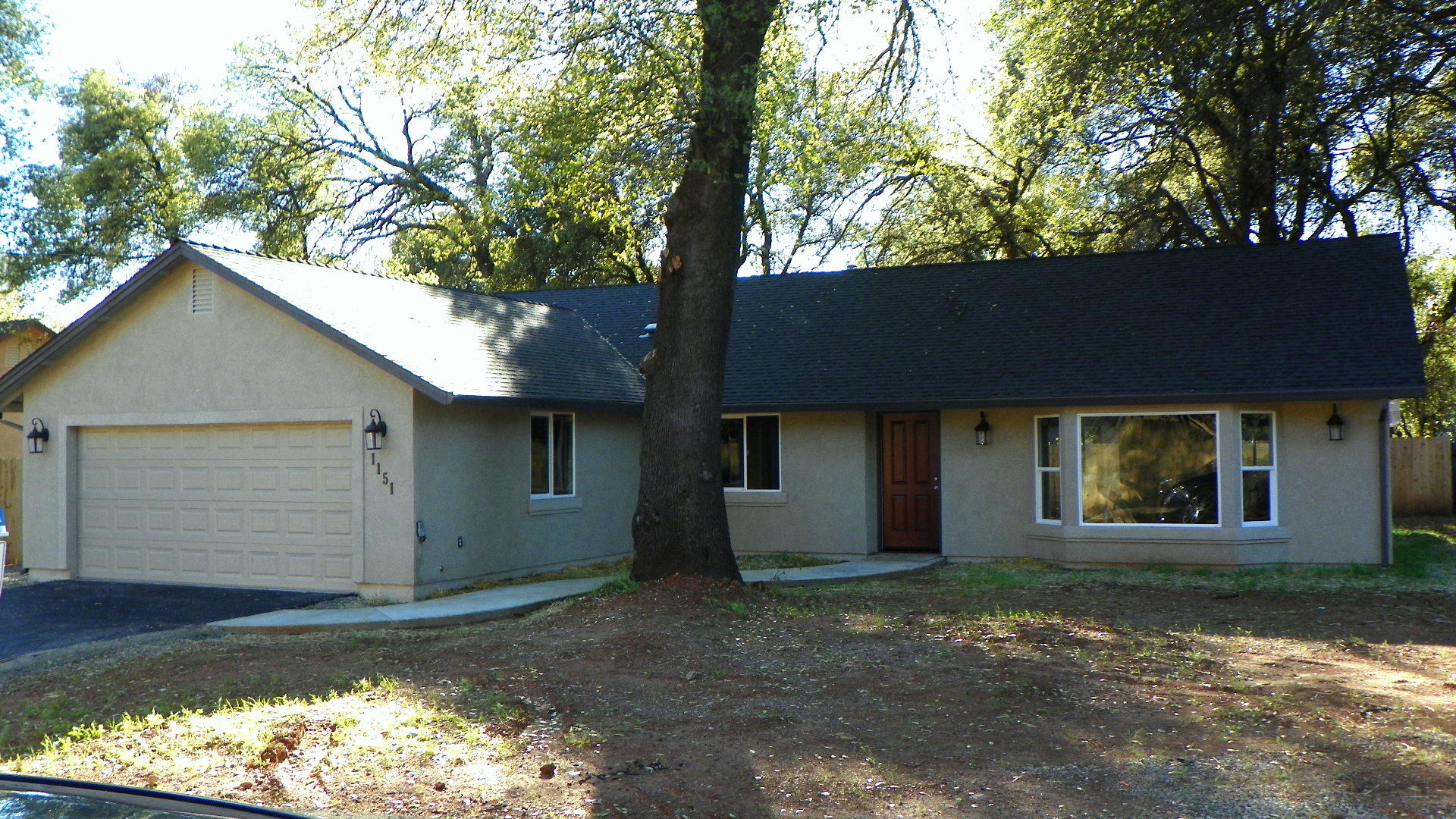 1151 Harpole Road Redding, CA 96002 - Photo 1 of 17 front view of a house with a large window