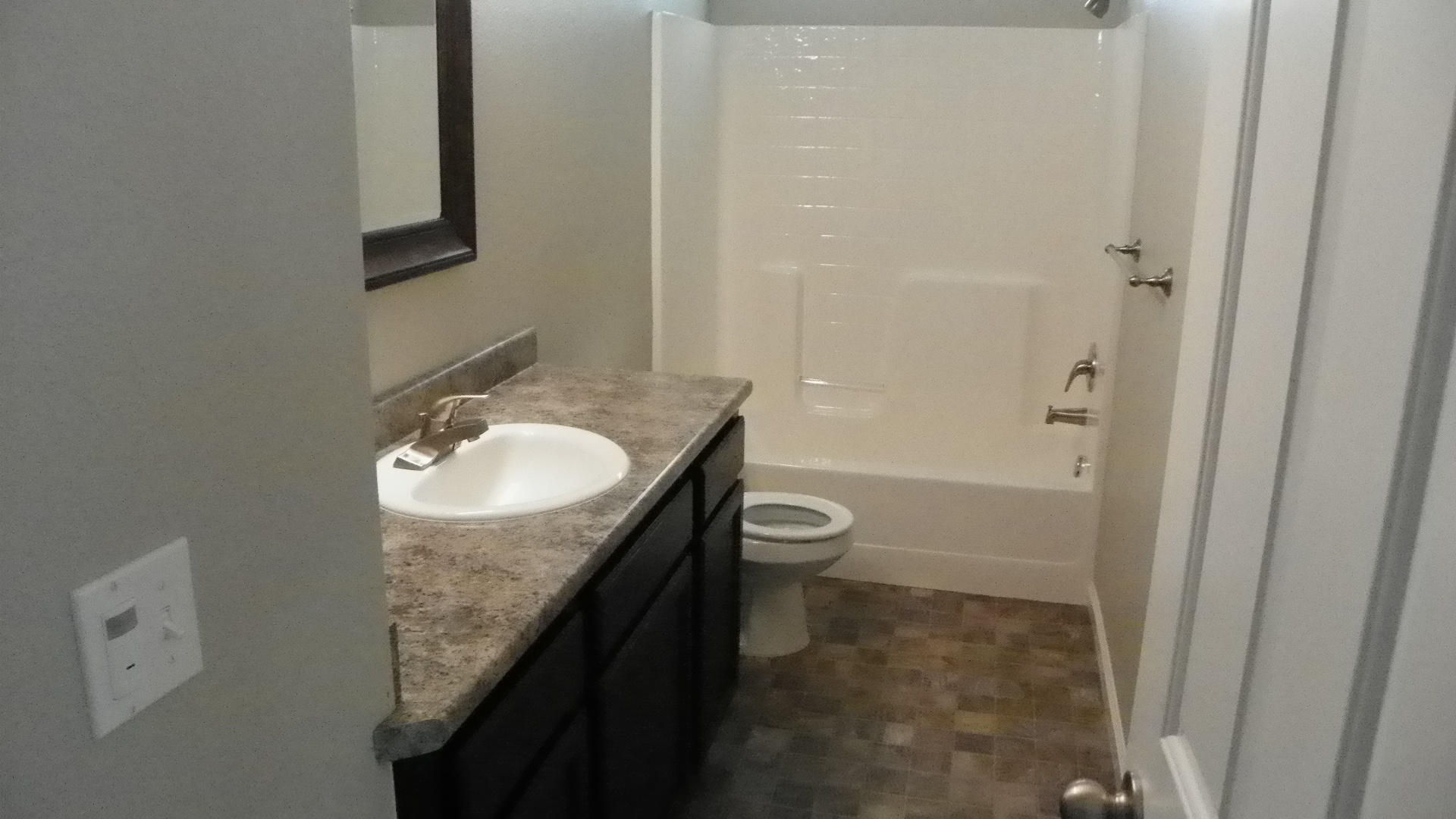1151 Harpole Road Redding, CA 96002 - Photo 11 of 17 a bathroom with a granite countertop sink toilet and shower