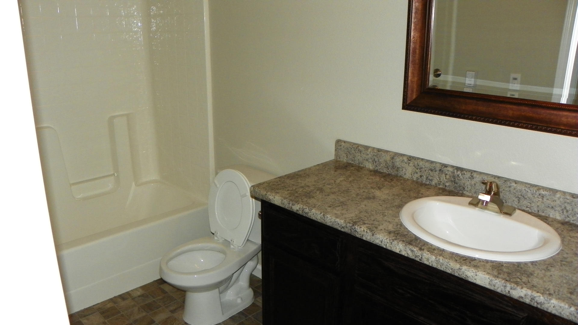 1151 Harpole Road Redding, CA 96002 - Photo 15 of 17 a bathroom with a granite countertop sink and a mirror