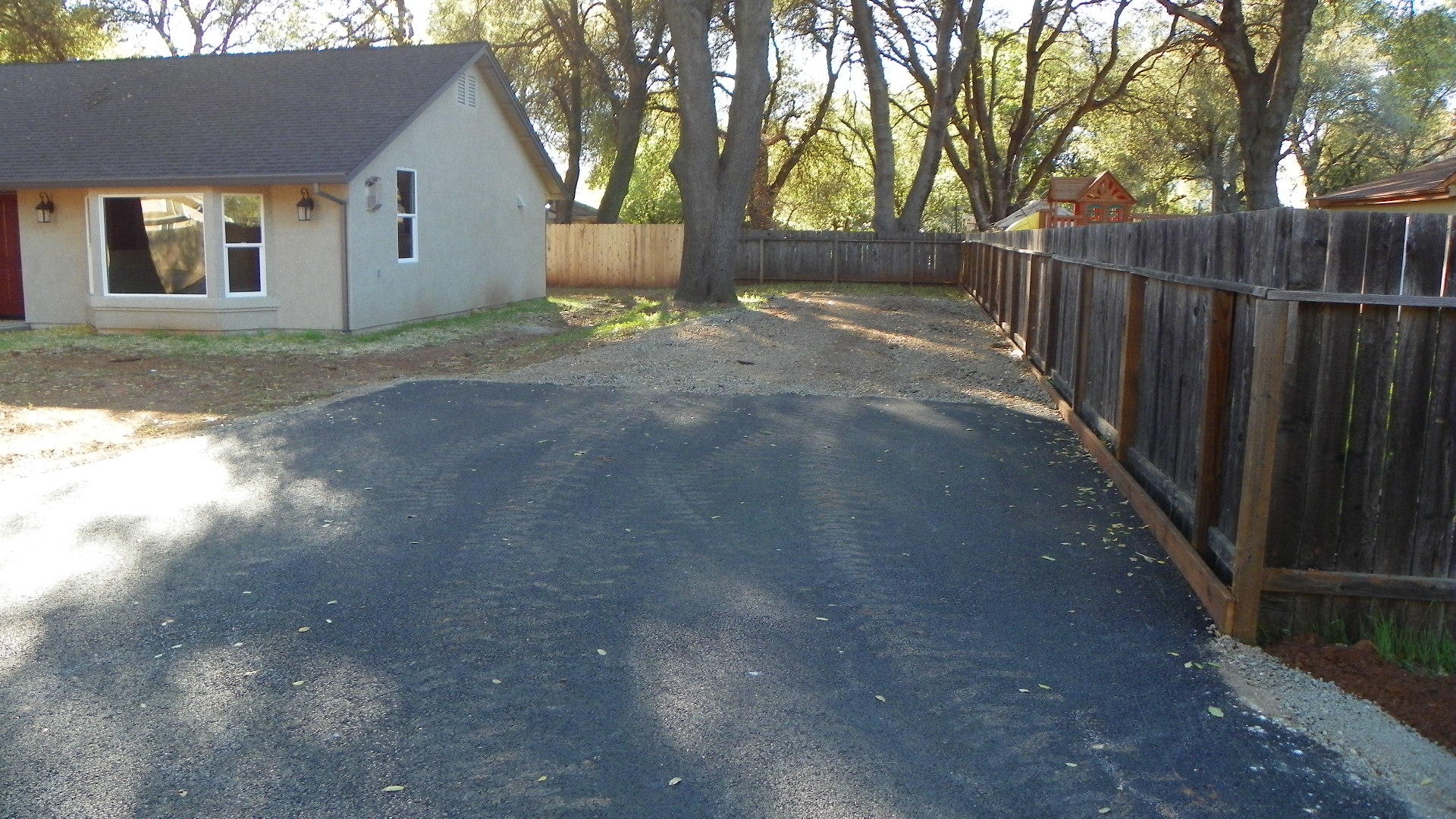 1151 Harpole Road Redding, CA 96002 - Photo 3 of 17 a view of backyard of house with trees