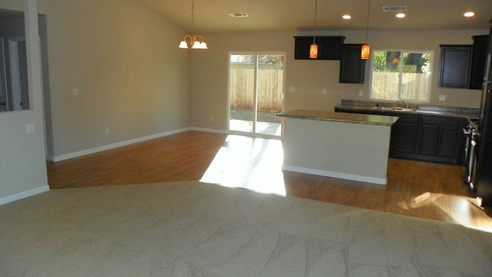 1151 Harpole Road Redding, CA 96002 - Photo 10 of 17 a kitchen with granite countertop sink and cabinets