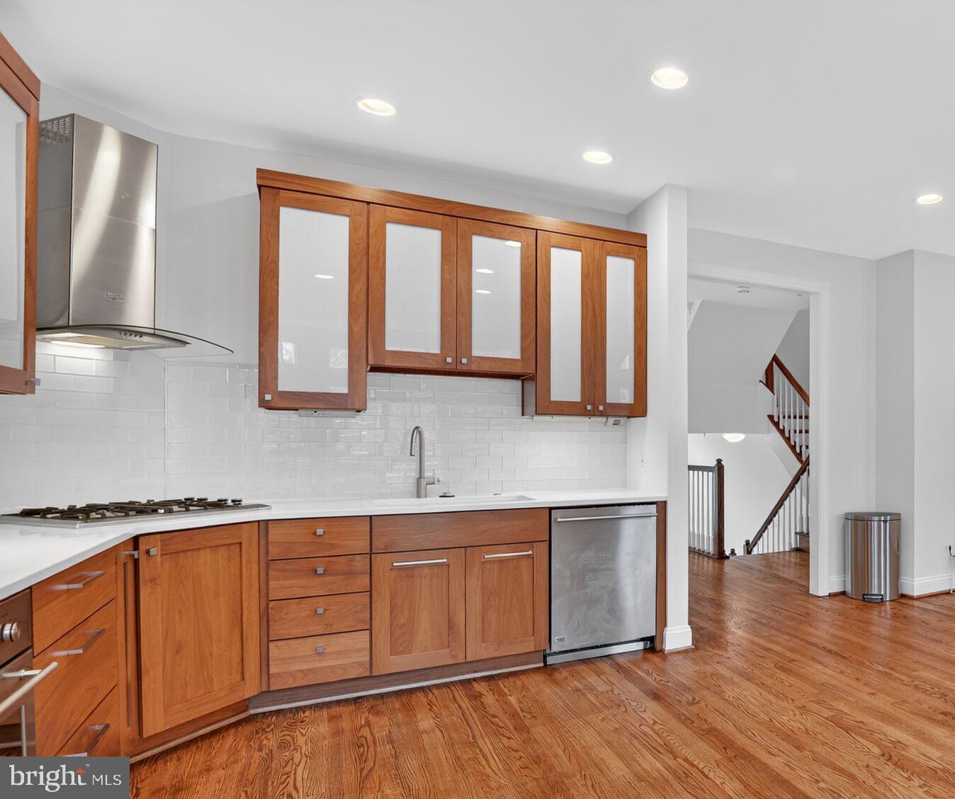 4015 Mansion Drive Northwest Washington, DC 20007 - Photo 11 of 34 a view of a kitchen with wooden floor and electronic appliances
