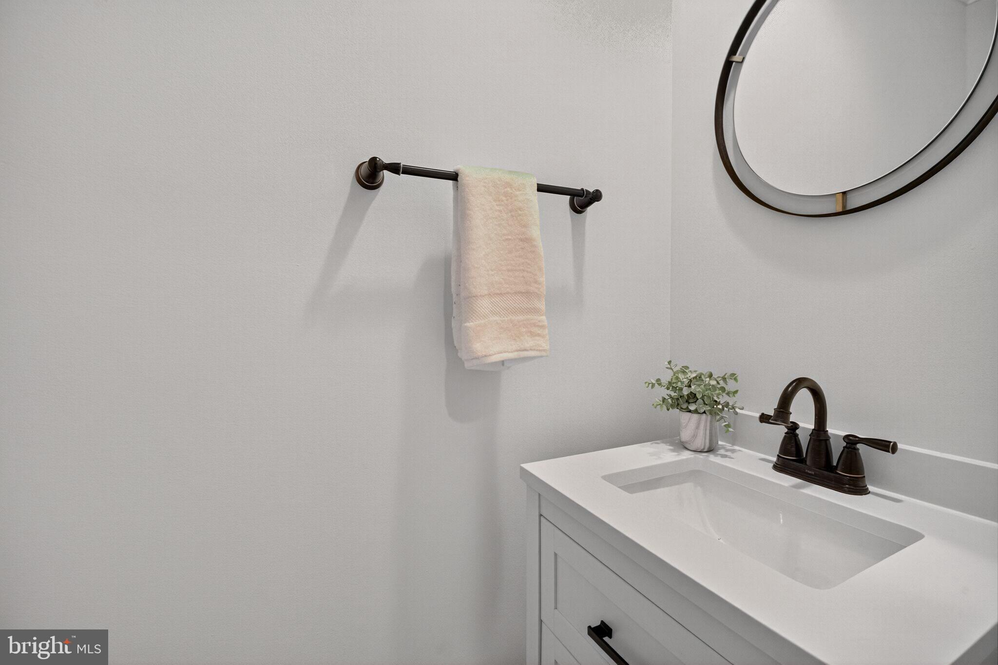 4015 Mansion Drive Northwest Washington, DC 20007 - Photo 13 of 34 a bathroom with a sink and a mirror