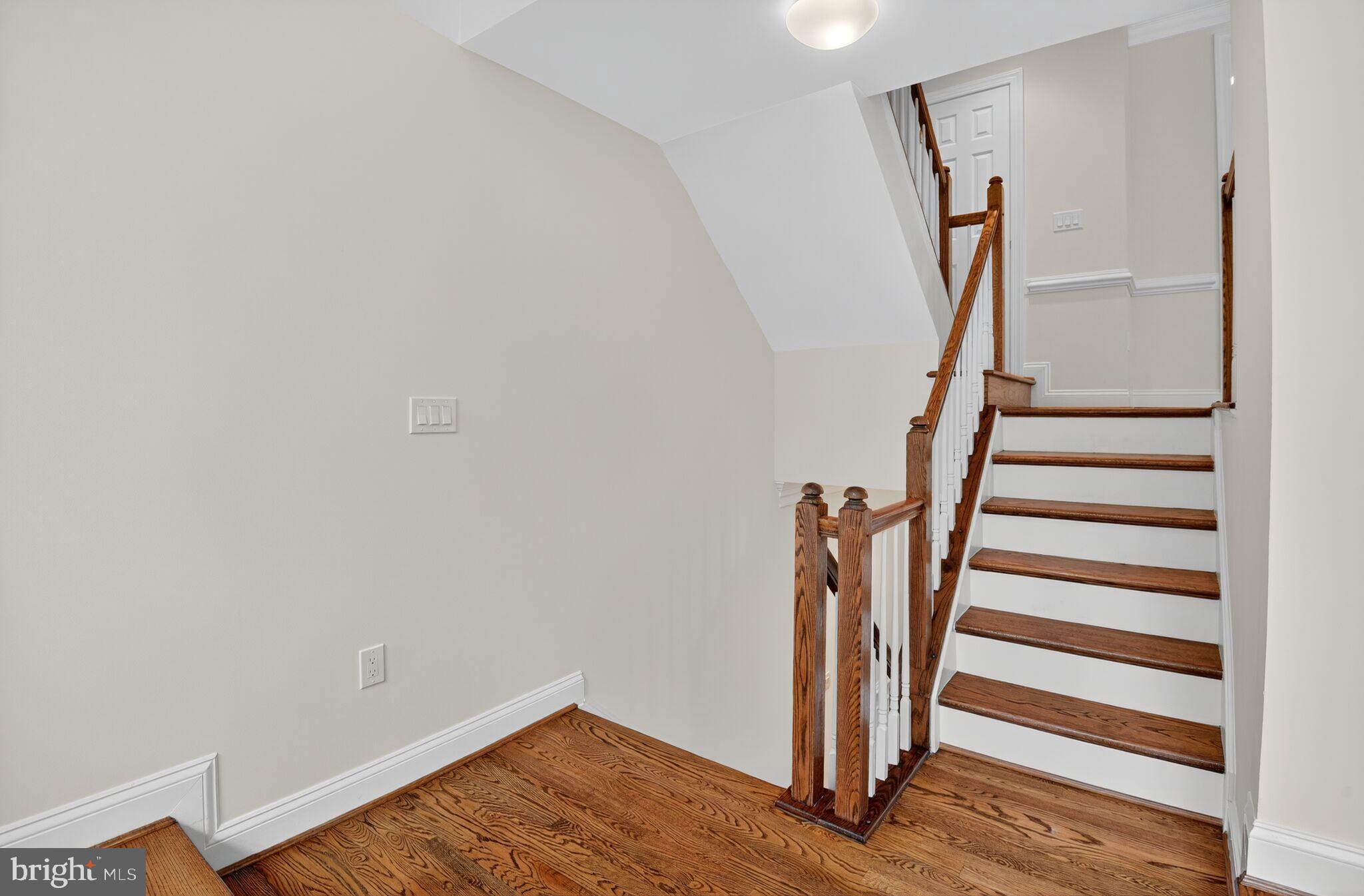 4015 Mansion Drive Northwest Washington, DC 20007 - Photo 14 of 34 a view of entryway with wooden floor and stairs