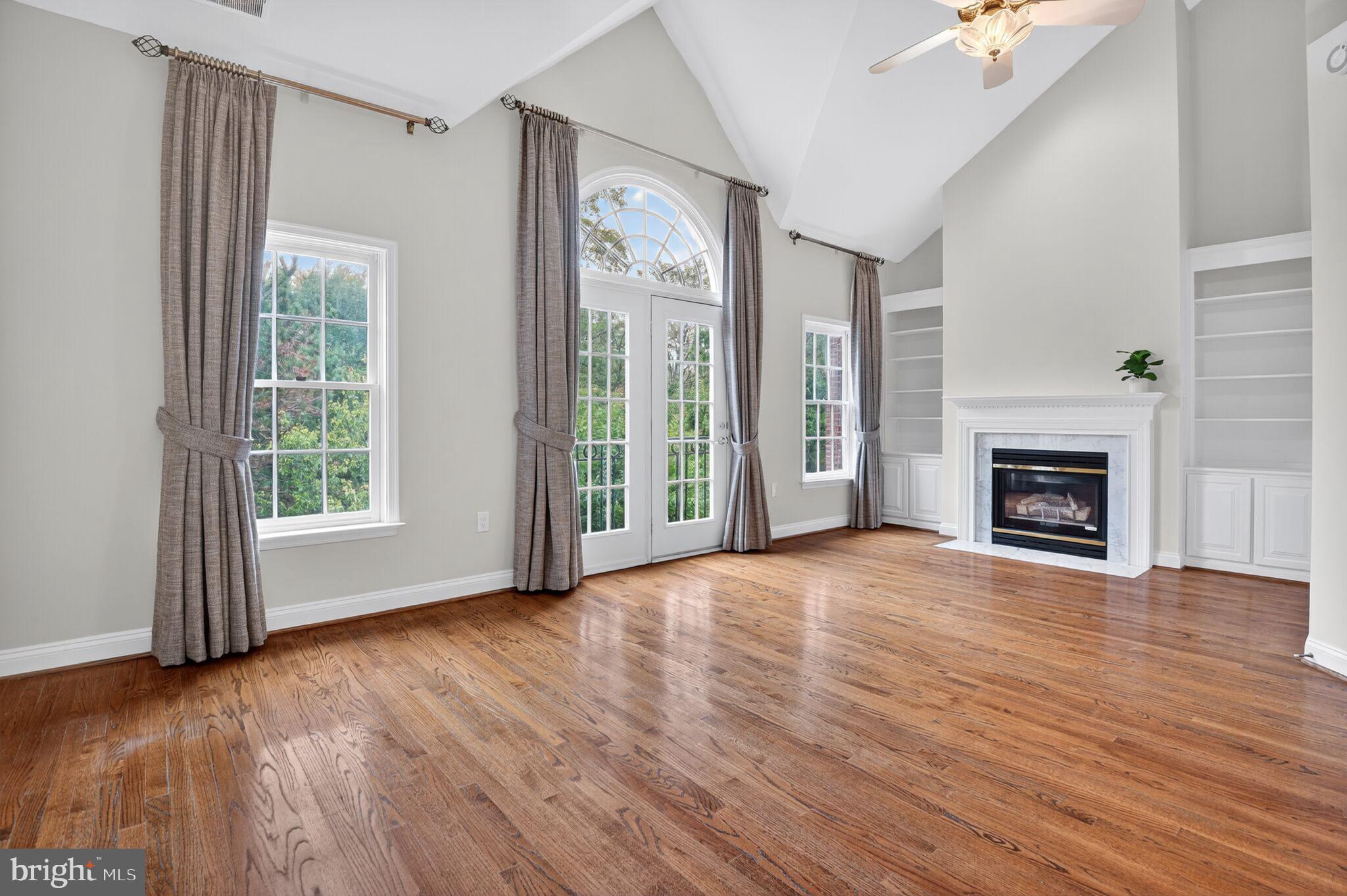 4015 Mansion Drive Northwest Washington, DC 20007 - Photo 15 of 34 a view of an empty room with wooden floor and a window