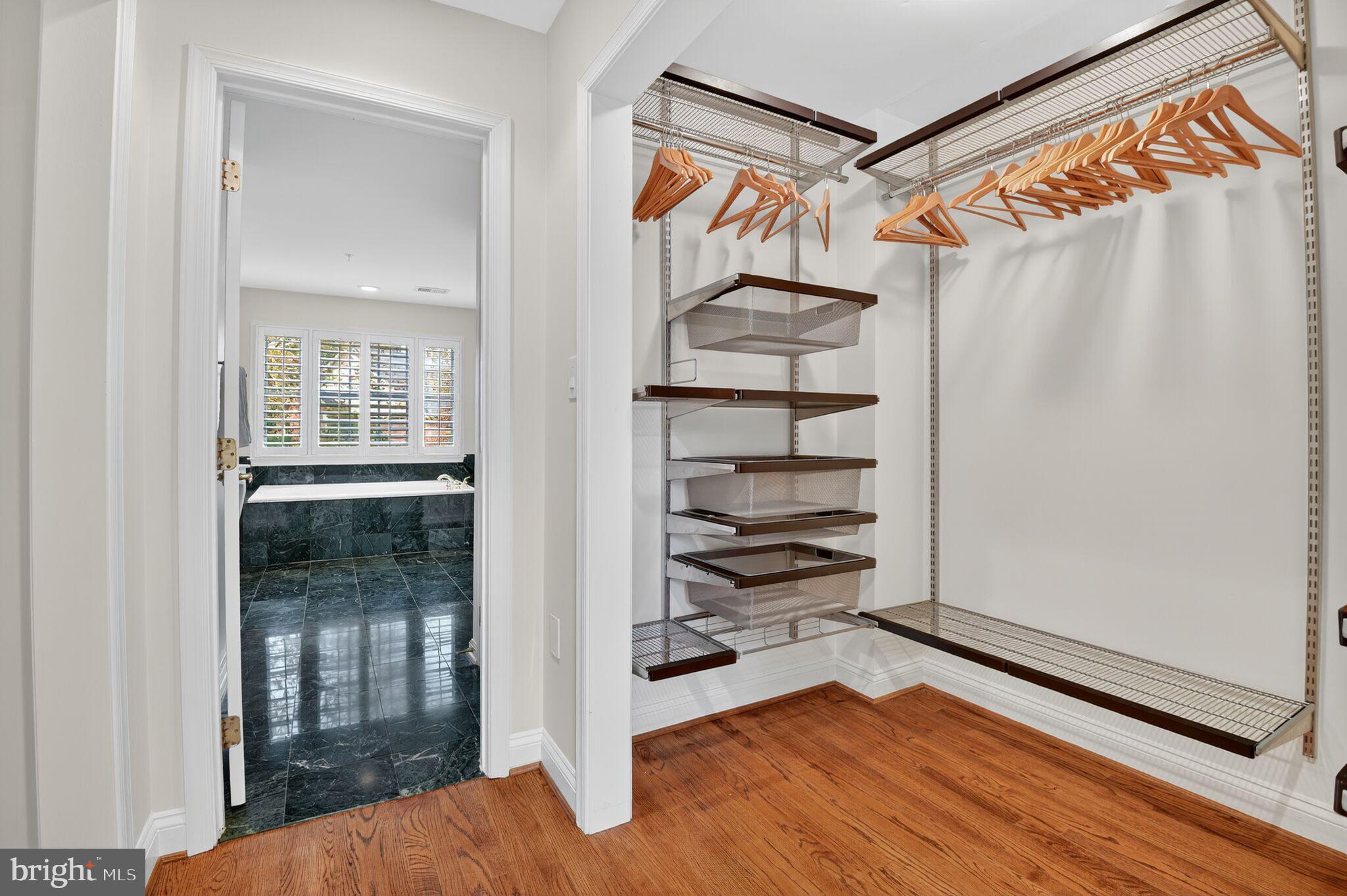4015 Mansion Drive Northwest Washington, DC 20007 - Photo 18 of 34 a view of walk in closet with empty racks