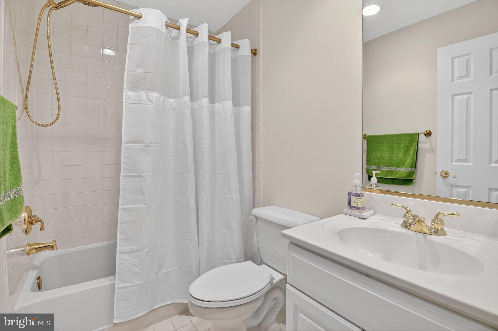 4015 Mansion Drive Northwest Washington, DC 20007 - Photo 20 of 34 a bathroom with a sink toilet and shower