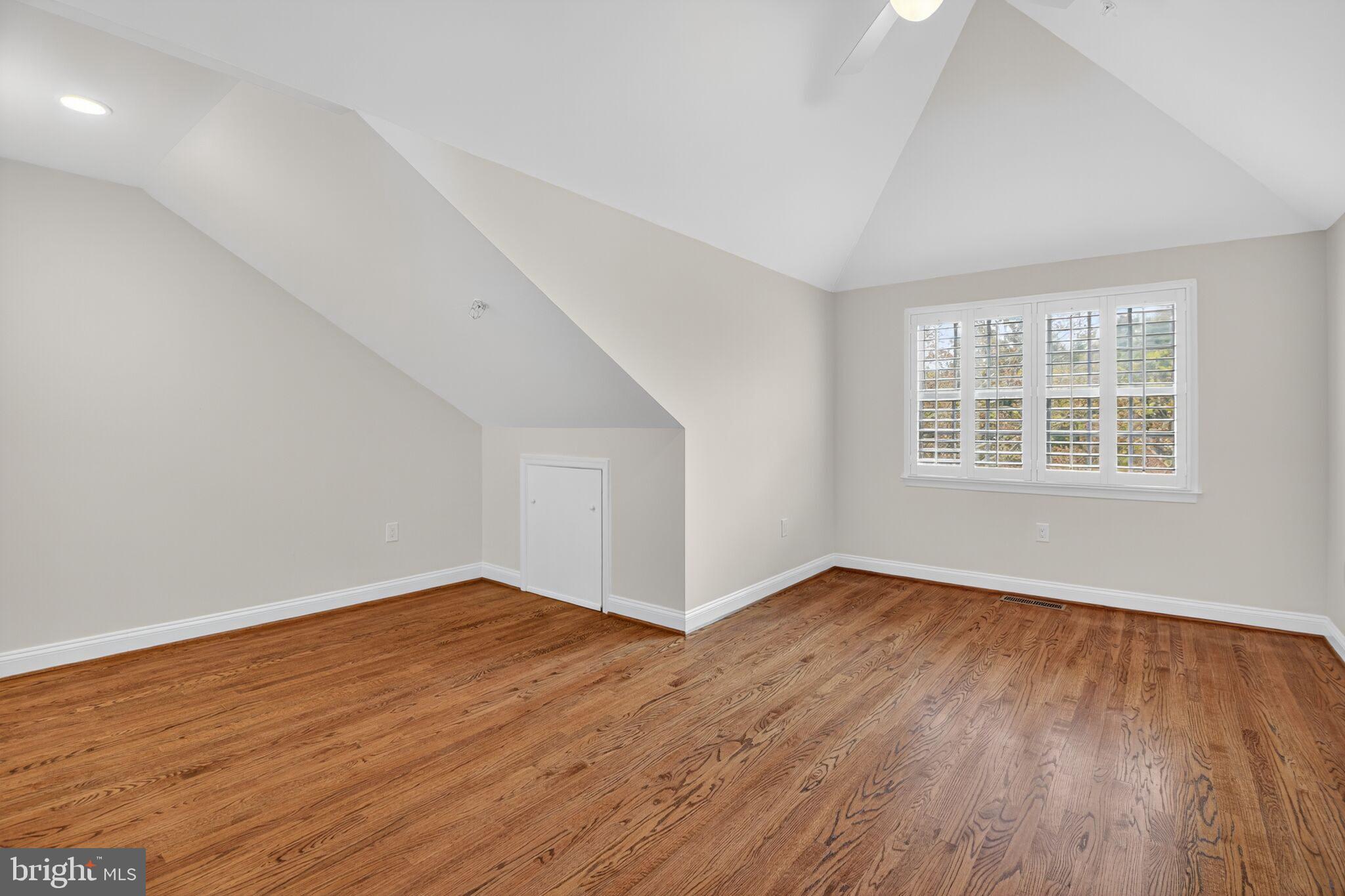 4015 Mansion Drive Northwest Washington, DC 20007 - Photo 23 of 34 an empty room with wooden floor and windows