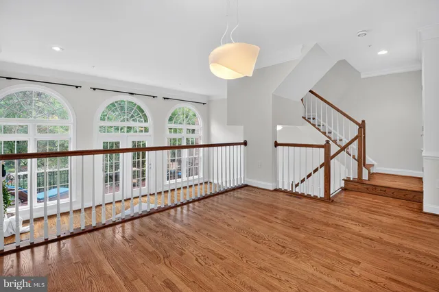 a large kitchen with stainless steel appliances granite countertop a refrigerator and a sink