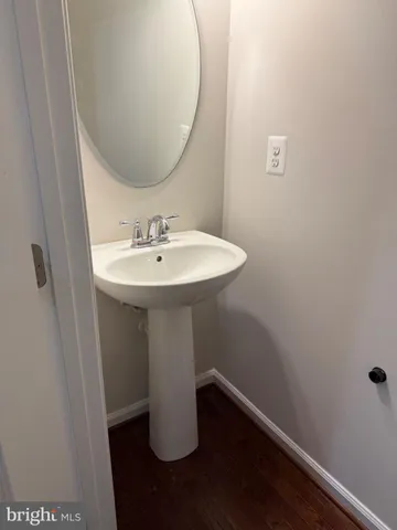 a white toilet sitting next to a shower