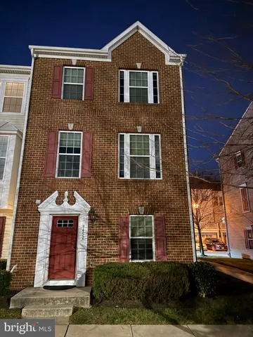 a front view of residential houses with pathway