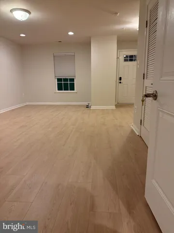 a white toilet sitting next to a sink