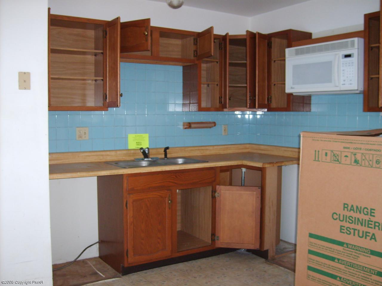 267 Pne Rdg Drive Bushkill, PA 18324 - Photo 3 of 4 a kitchen with a sink and cabinets