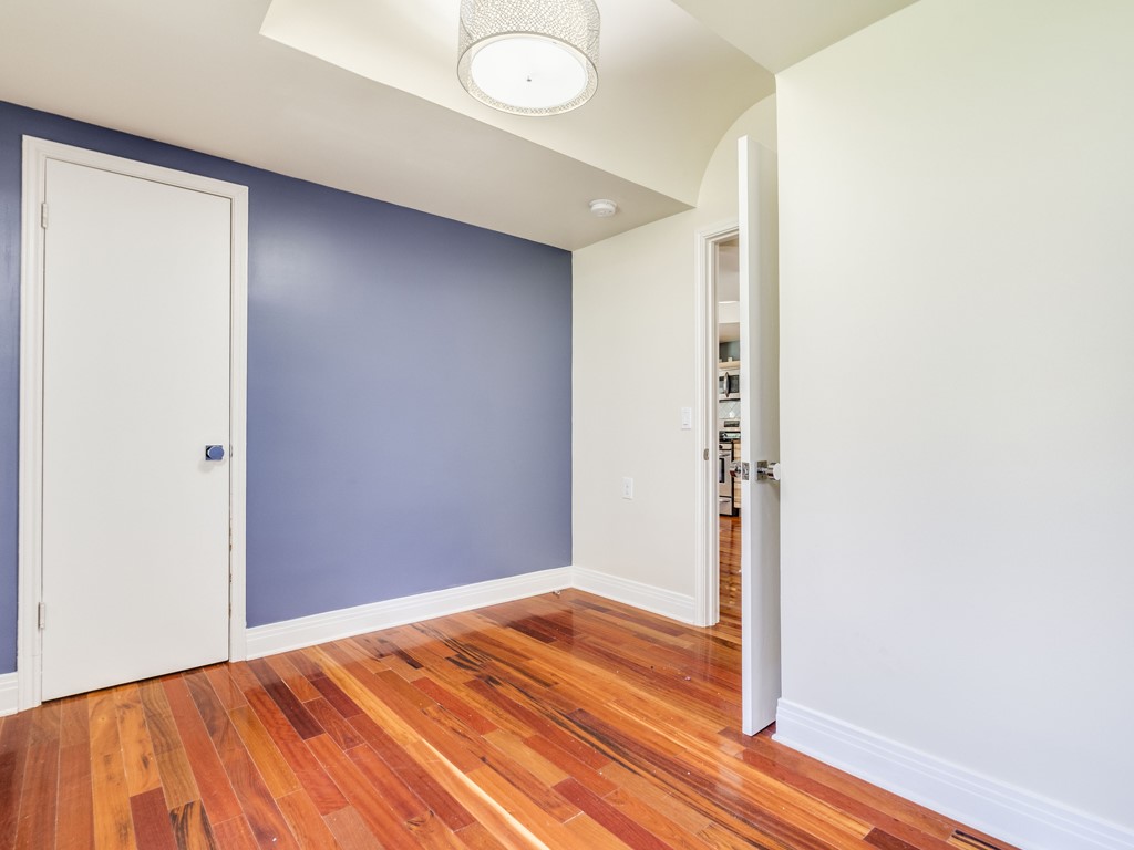2314 Santa Rosa Street Austin, TX 78702 - Photo 14 of 27 Unfurnished room featuring light wood-type flooring and baseboards