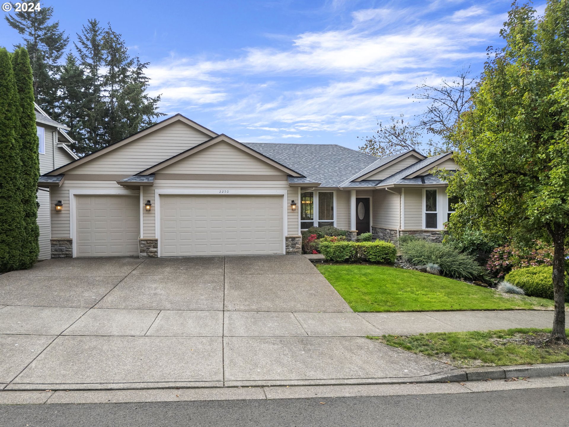 2250 Crestview Drive West Linn, OR 97068 - Photo 1 of 48 a front view of a house with a yard and garage