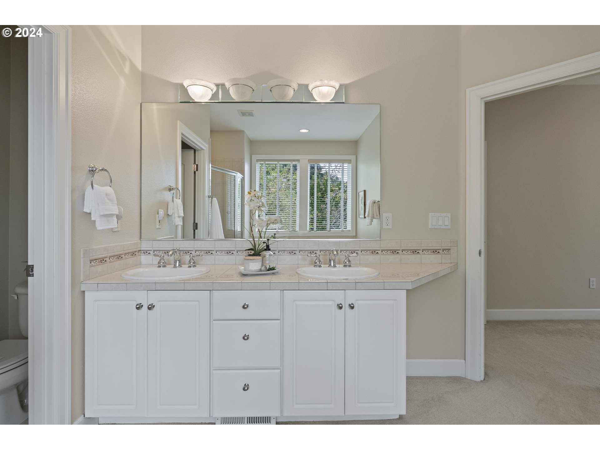 2250 Crestview Drive West Linn, OR 97068 - Photo 12 of 48 a bathroom with a granite countertop sink a large mirror and a