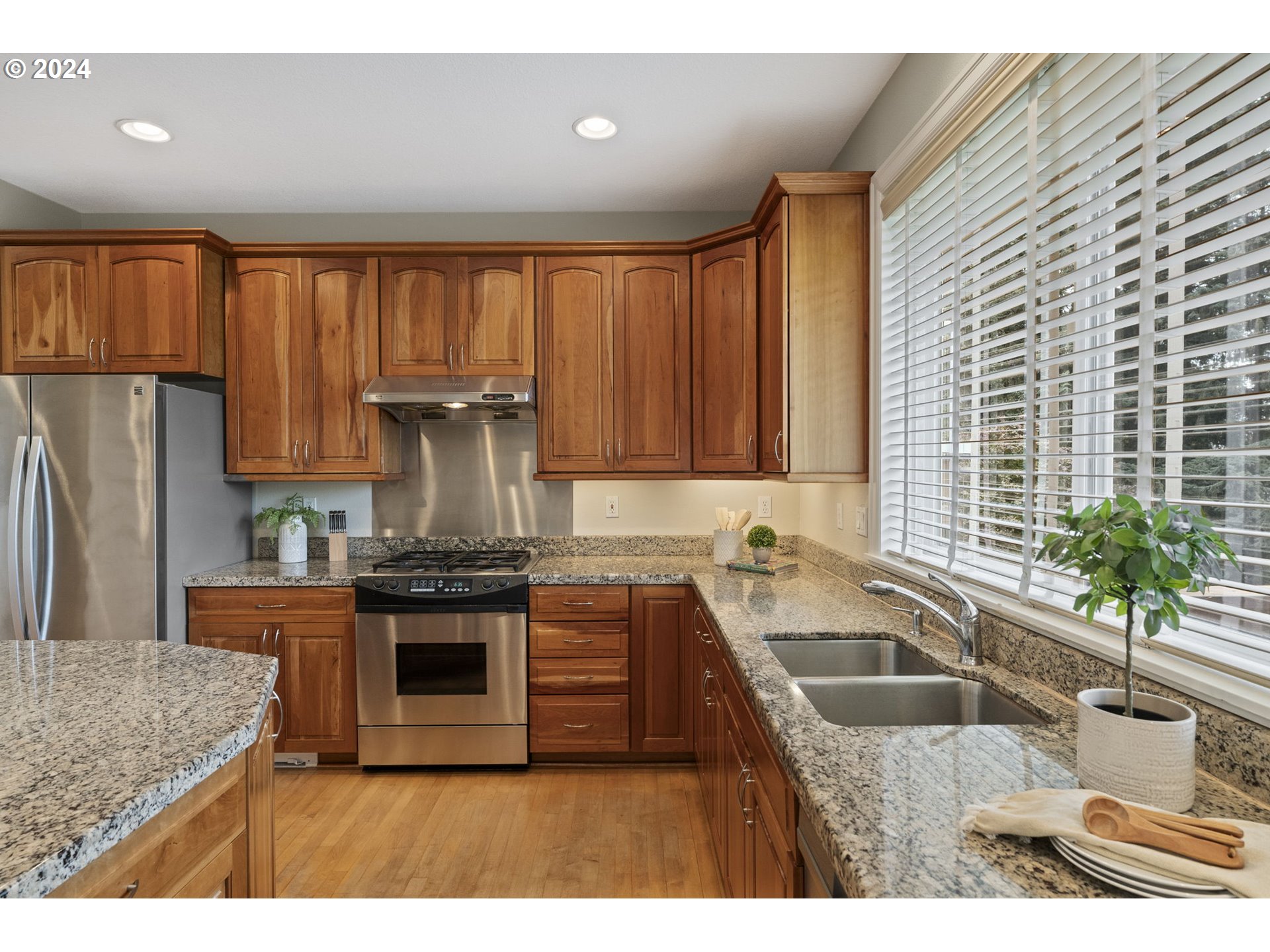 2250 Crestview Drive West Linn, OR 97068 - Photo 23 of 48 a kitchen with kitchen island granite countertop a sink stove and refrigerator