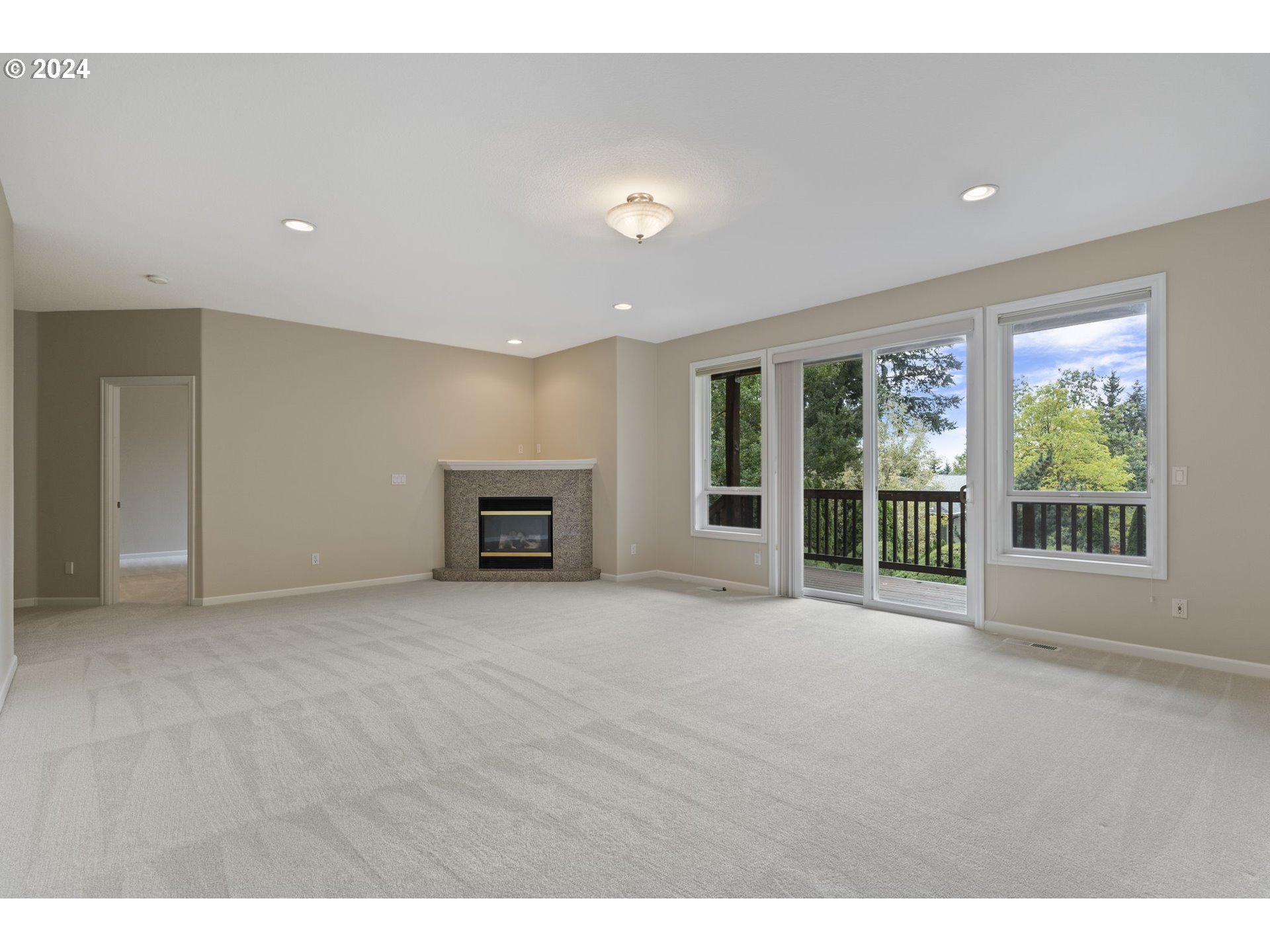 2250 Crestview Drive West Linn, OR 97068 - Photo 31 of 48 a view of an empty room with a fireplace and a window