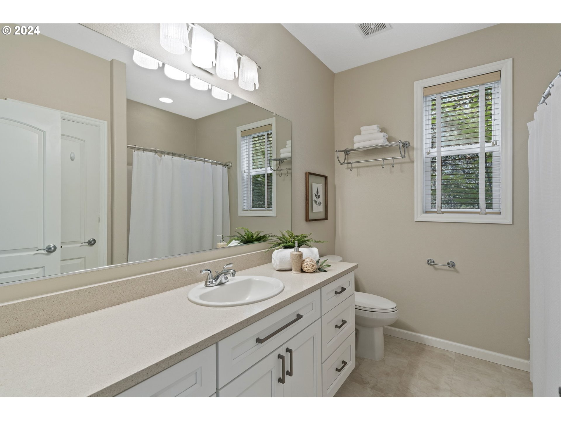2250 Crestview Drive West Linn, OR 97068 - Photo 36 of 48 a bathroom with a sink a toilet and a mirror