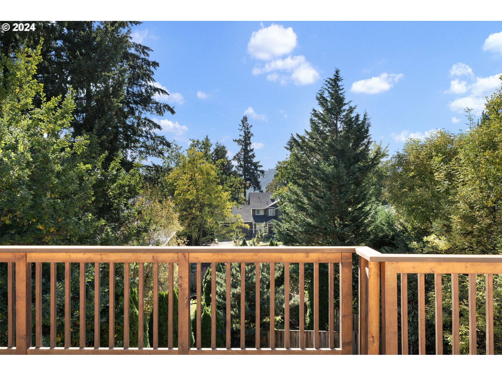 2250 Crestview Drive West Linn, OR 97068 - Photo 42 of 48 a wooden fence with trees in the background