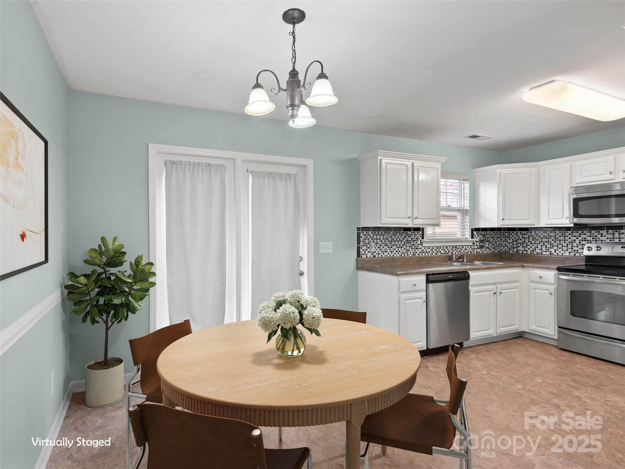 24 Torrington Avenue Fletcher, NC 28732 - Photo 8 of 32 a kitchen with sink and refrigerator