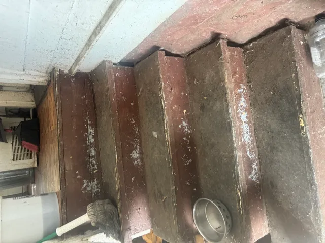 a bathroom with a shower and a sink