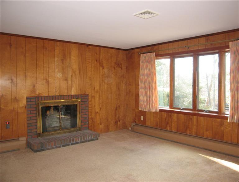1800 South County Road Osterville, MA 02655 - Photo 5 of 17 a view of an empty room with a fireplace and a window