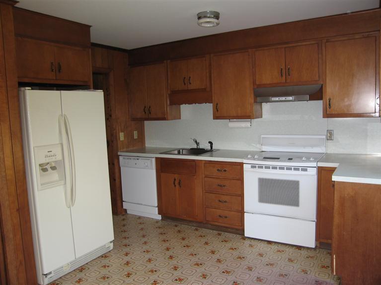 1800 South County Road Osterville, MA 02655 - Photo 8 of 17 a kitchen with stainless steel appliances granite countertop a refrigerator sink and cabinets