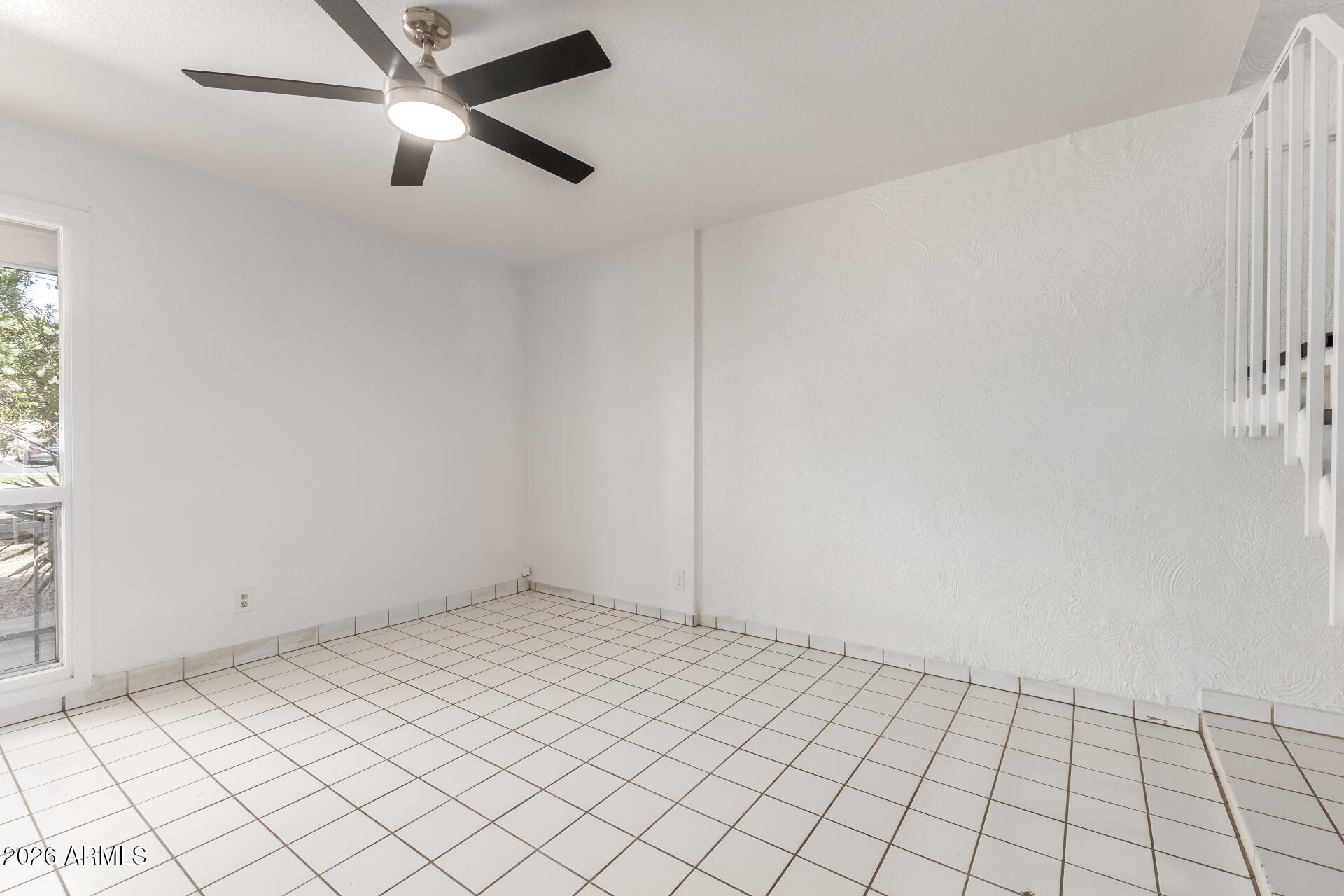 6348 North 7th Avenue, Unit 1 Phoenix, AZ 85013 - Photo 8 of 36 an empty room with windows