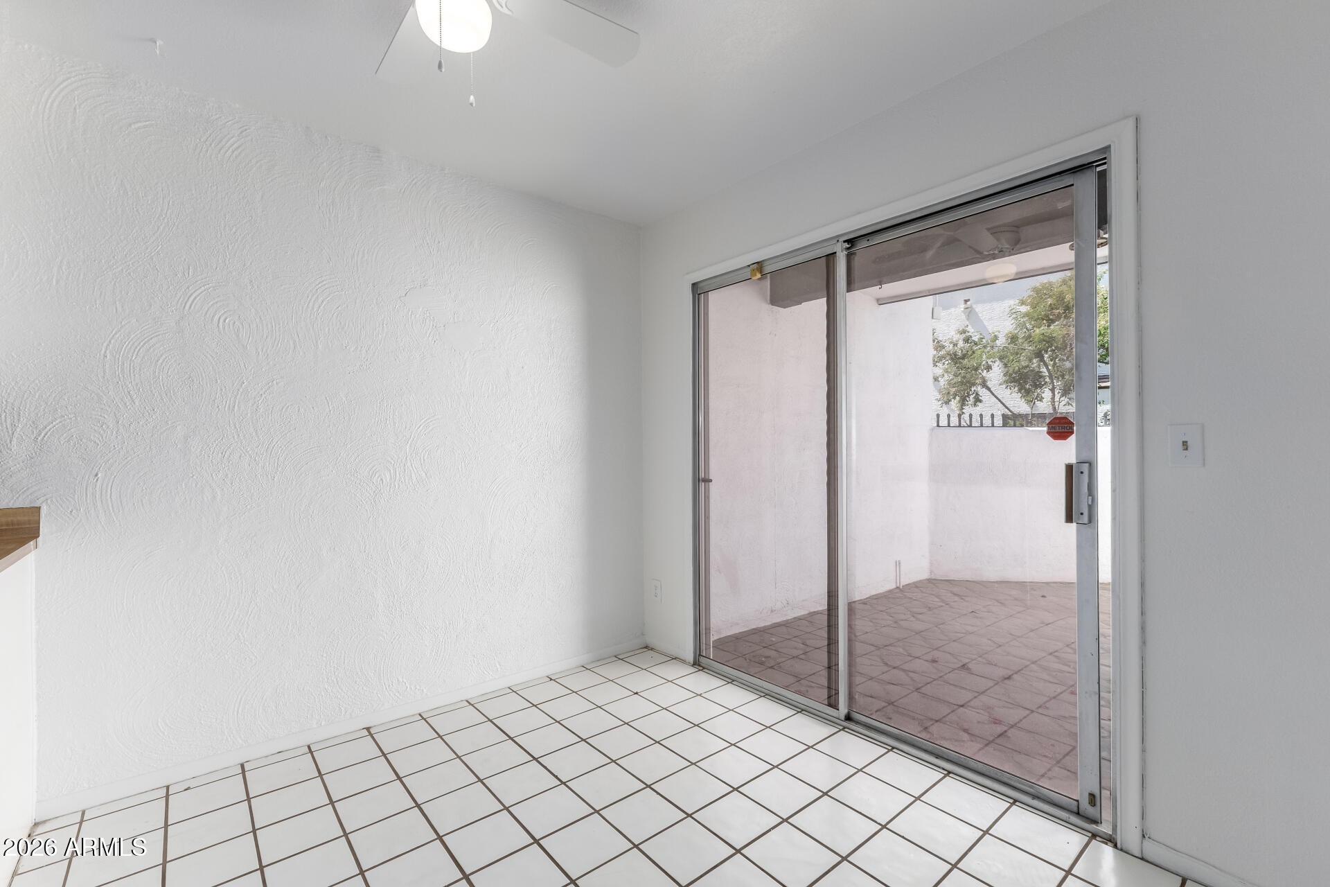 6348 North 7th Avenue, Unit 1 Phoenix, AZ 85013 - Photo 11 of 36 a view of an empty room and window in a room
