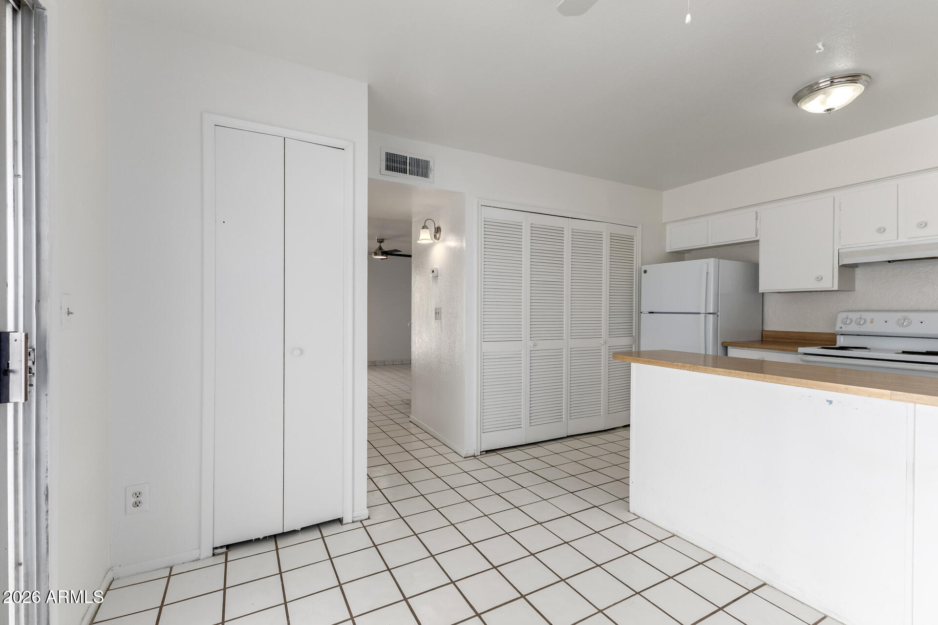 6348 North 7th Avenue, Unit 1 Phoenix, AZ 85013 - Photo 12 of 36 a kitchen with stainless steel appliances a refrigerator and a sink