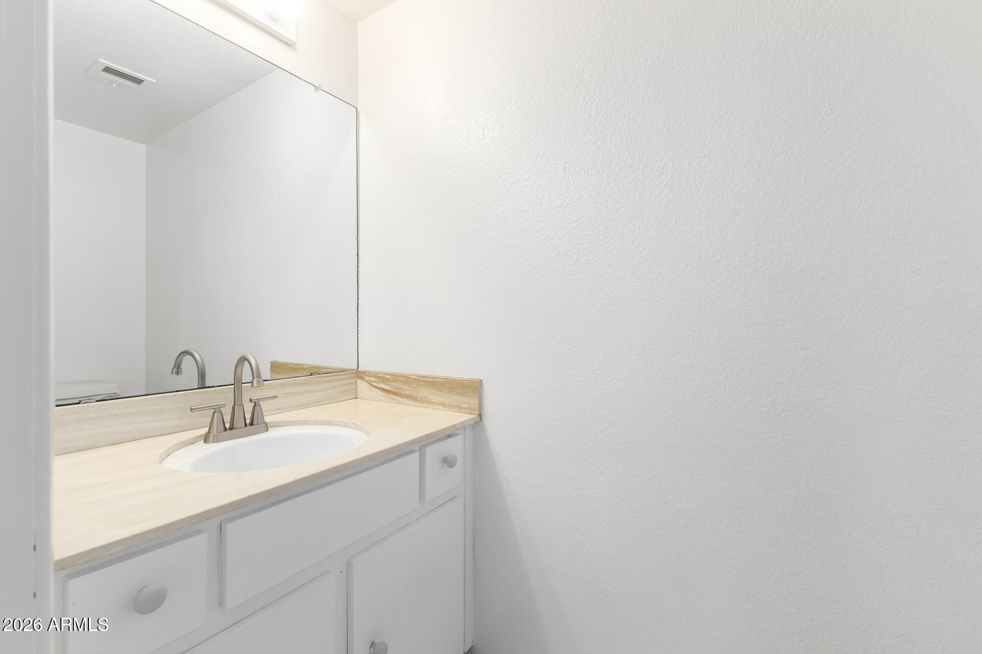 6348 North 7th Avenue, Unit 1 Phoenix, AZ 85013 - Photo 16 of 36 a bathroom with a sink and a mirror