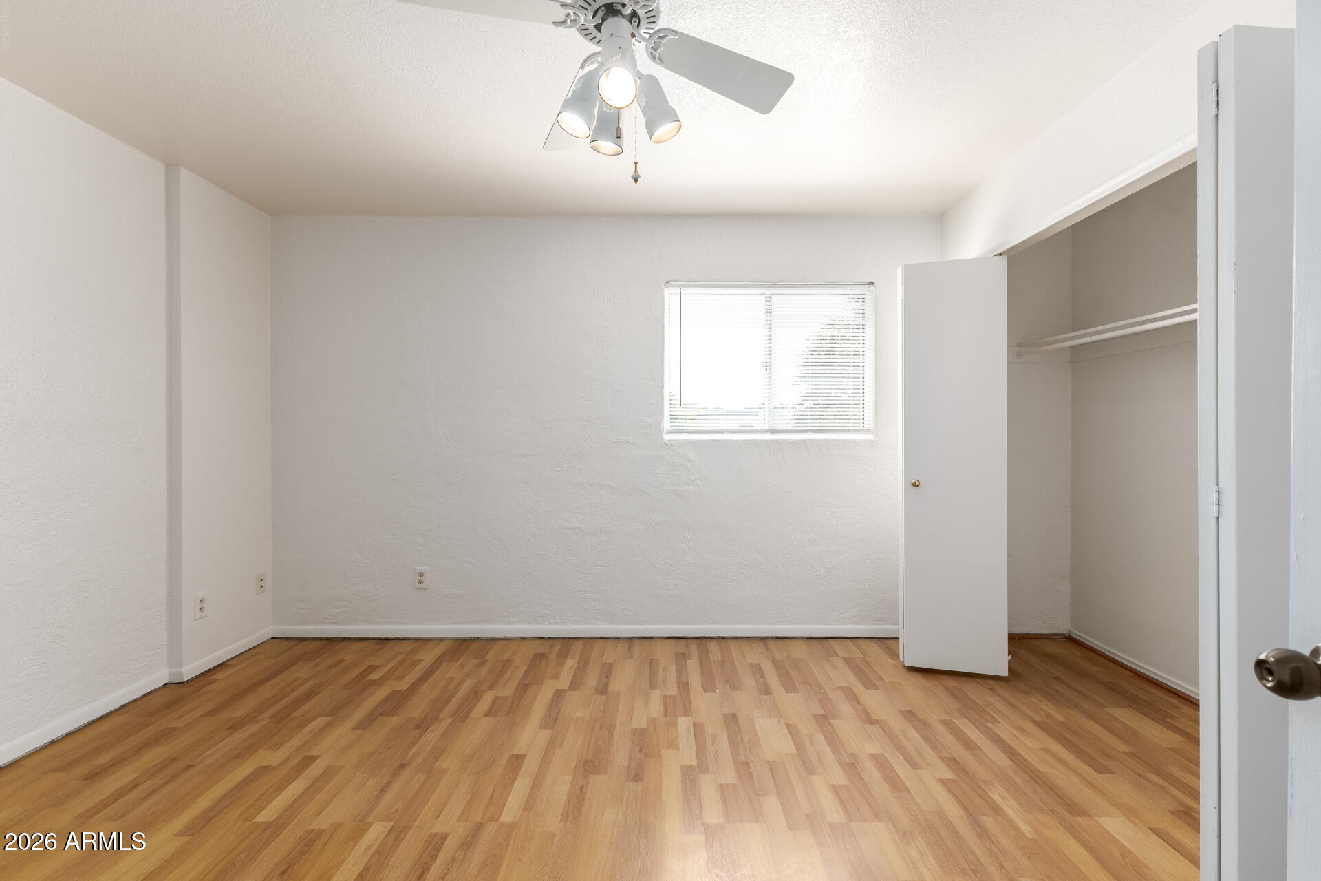 6348 North 7th Avenue, Unit 1 Phoenix, AZ 85013 - Photo 21 of 36 wooden floor in an empty room with a window
