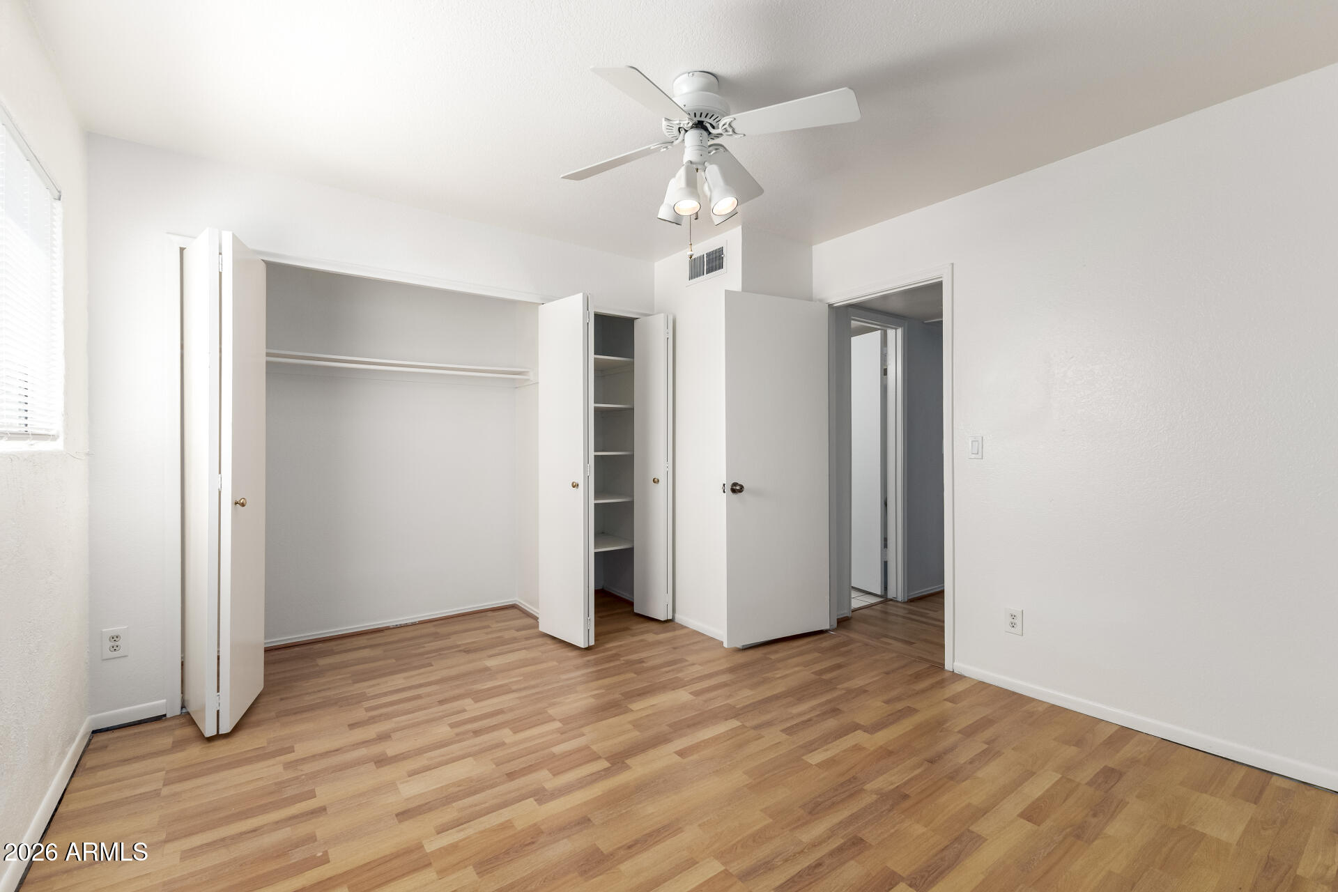 6348 North 7th Avenue, Unit 1 Phoenix, AZ 85013 - Photo 22 of 36 a view of an empty room with a ceiling fan