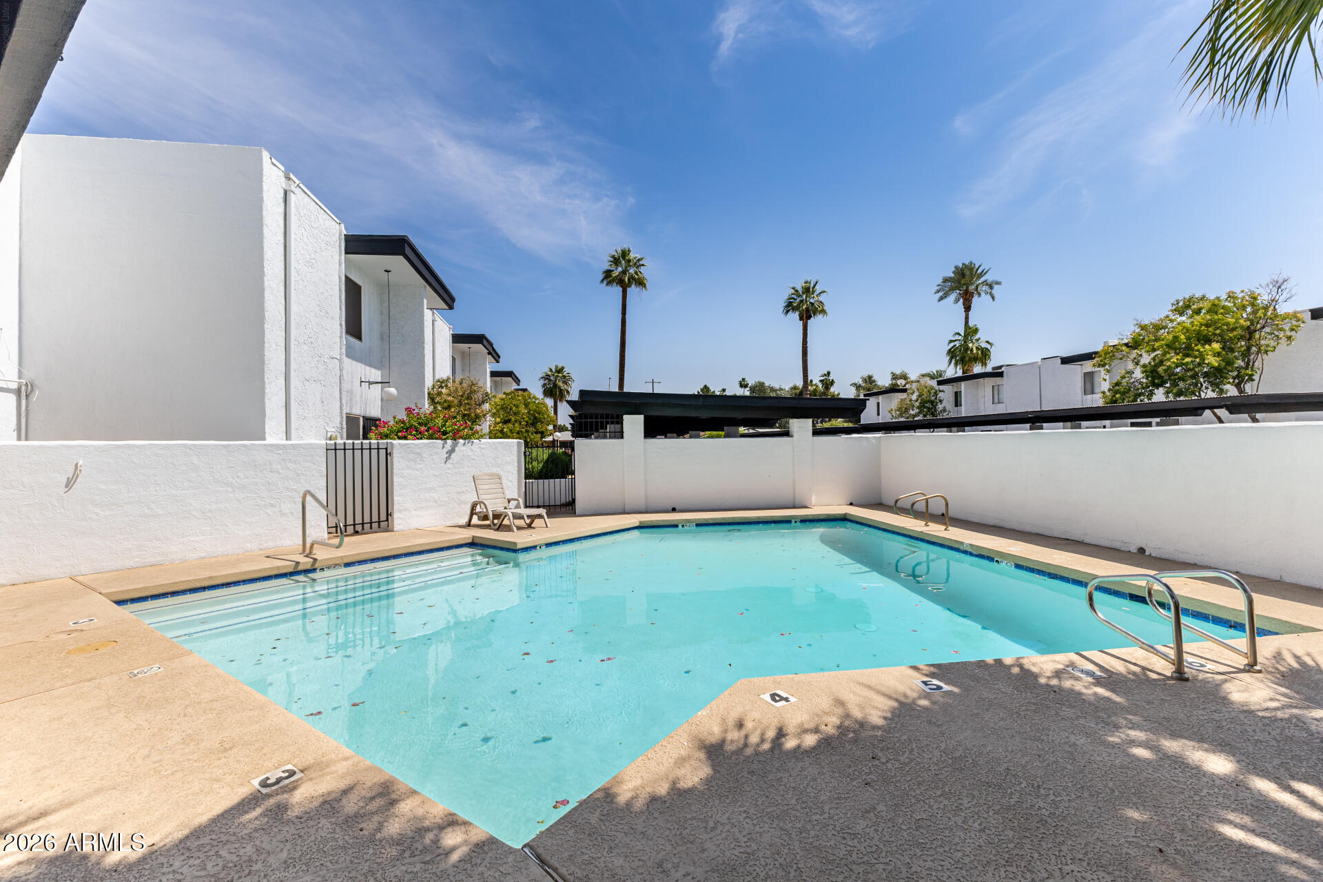 6348 North 7th Avenue, Unit 1 Phoenix, AZ 85013 - Photo 5 of 36 a view of a swimming pool with an outdoor seating