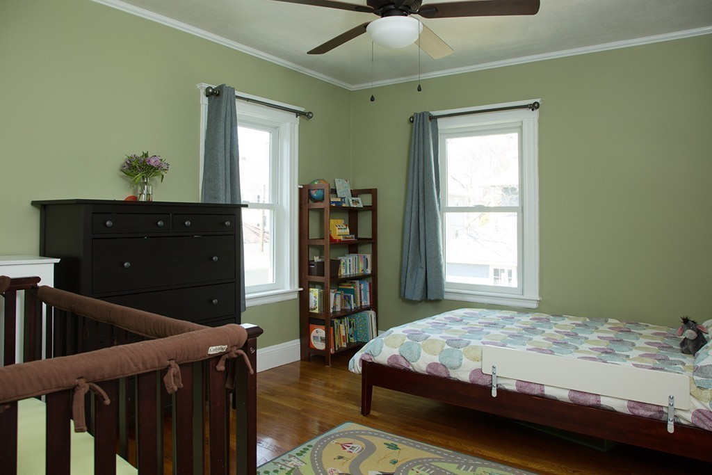 11 Pershing Road, Unit 2 Boston, MA 02130 - Photo 8 of 12 a bedroom with a bed and a dresser
