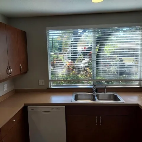 a view of a sink and microwave