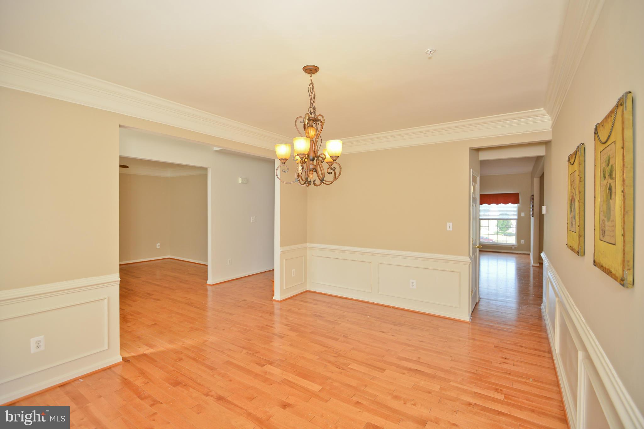 14618 Bubbling Spring Road Boyds, MD 20841 - Photo 5 of 26 a view of livingroom with hardwood floor and kitchen view