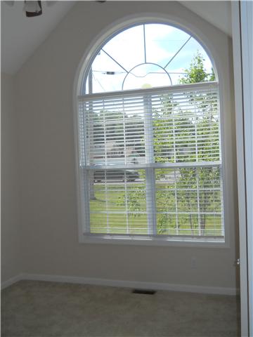 238 Hunt Creek Road Manchester, TN 37355 - Photo 17 of 19 Bedroom 2 has a vaulted ceiling and a ceiling fan. What a great window!