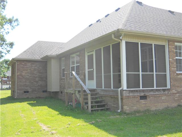 238 Hunt Creek Road Manchester, TN 37355 - Photo 3 of 19 The screened-in porch is a bonus feature in this home. Sit back, relax, and enjoy the breeze provided by the ceiling fan.