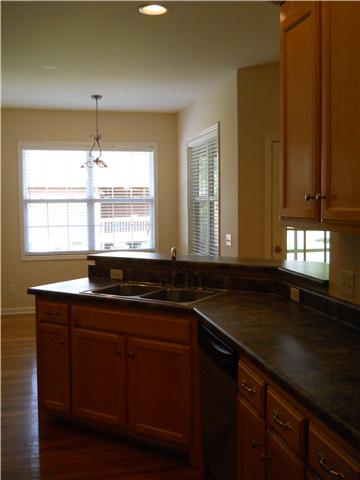 238 Hunt Creek Road Manchester, TN 37355 - Photo 9 of 19 Kitchen and eating area. Laundry area is to the left of the eating area. The windows provide lots of natural light as well as a view of the back yard.
