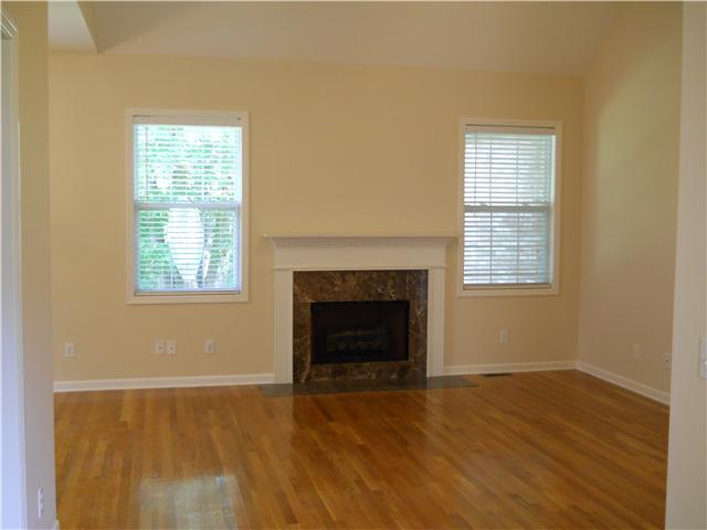 238 Hunt Creek Road Manchester, TN 37355 - Photo 10 of 19 The living room has a vaulted ceiling with a ceiling fan and a gas fireplace with marble surround. Look at the gorgeous hardwood floors!