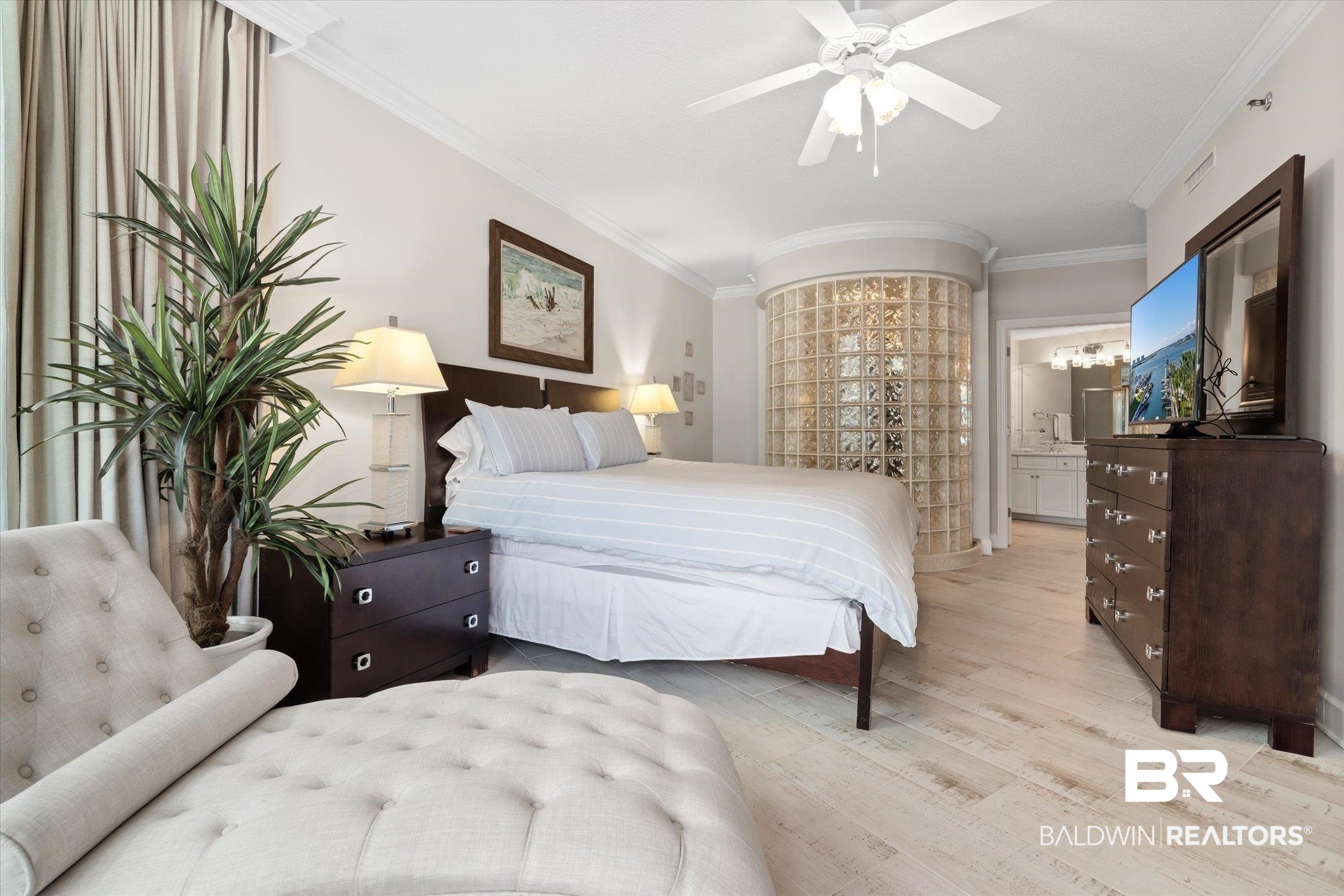 27582 Canal Road, Unit 2611 Orange Beach, AL 36561 - Photo 15 of 37 Bedroom featuring connected bathroom, light hardwood / wood-style floors, ornamental molding, and ceiling fan