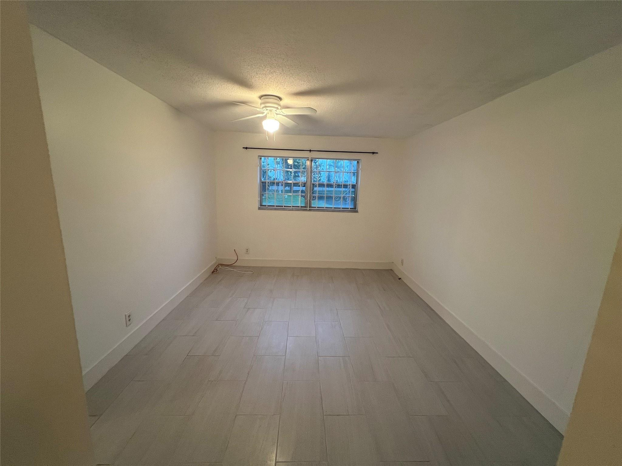 Undisclosed Address Dania Beach, FL 33004 - Photo 4 of 8 an empty room with a window